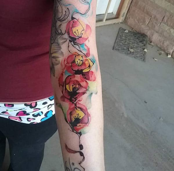 Monochrome bright colored flowers tattoo ideas on forearm for fashionable Girls