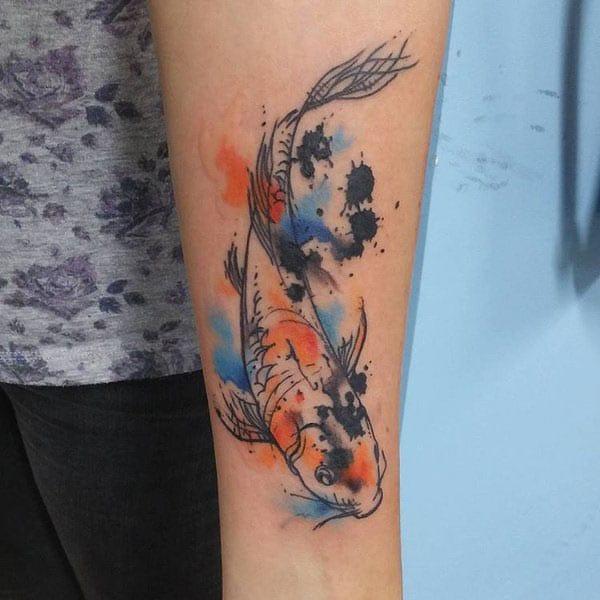 Ink splashed koi fish watercolor tattoo ideas on forearm for cosmopolitan women
