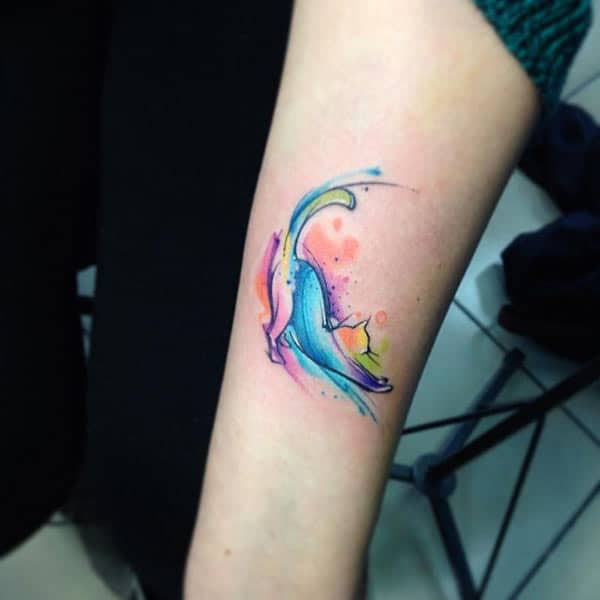 Attractive flashy playful cat watercolor ink tattoo ideas on forearm for female feline lovers