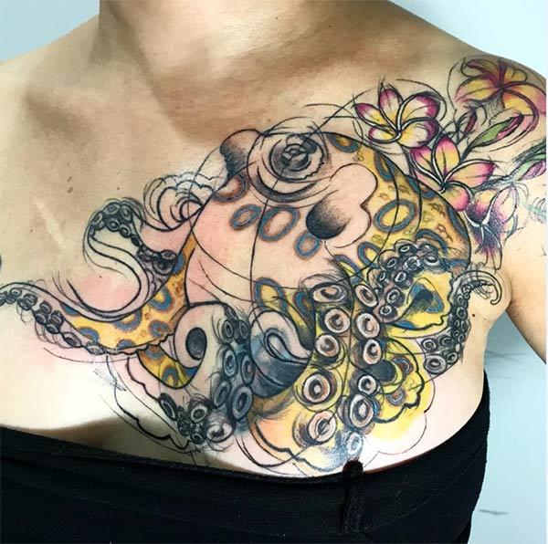 Vibrant octopus flowers watercolor tattoo on front shoulder for bold women