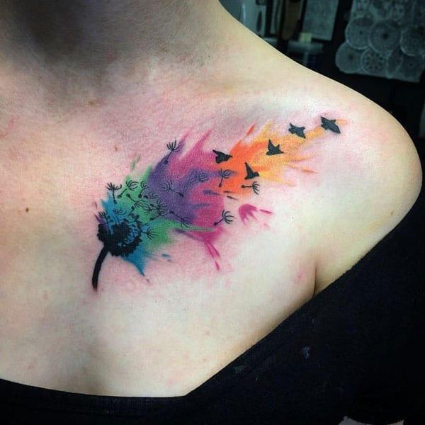 Captivating Vibrant colored windblown dandelion flower to birds tattoo on front shoulder for bold women