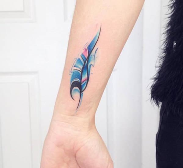 Cool elegant watercolor feather tattoo on hand for women
