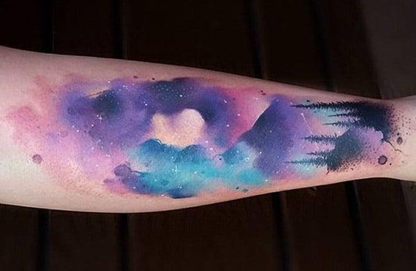 Mesmerizing night sky in forest hand tattoo designs for adventurous women