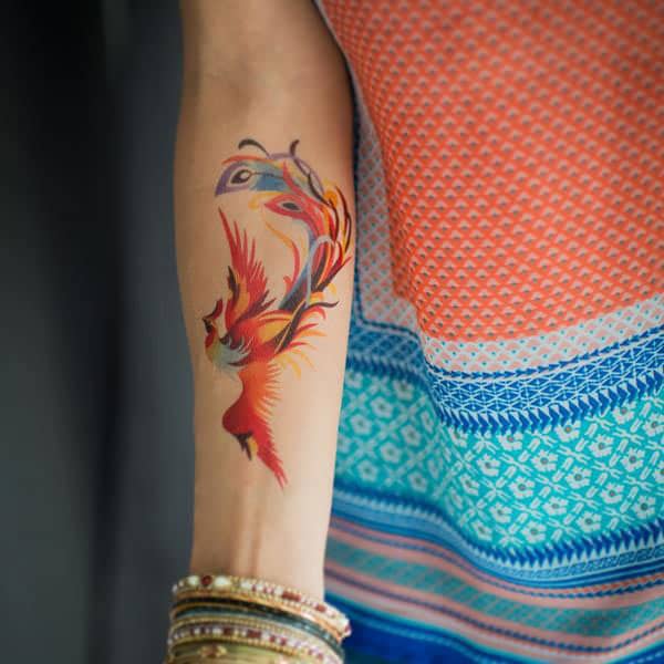 Stunning vibrant Fiery peacock hand watercolor tattoo designs for Girls
