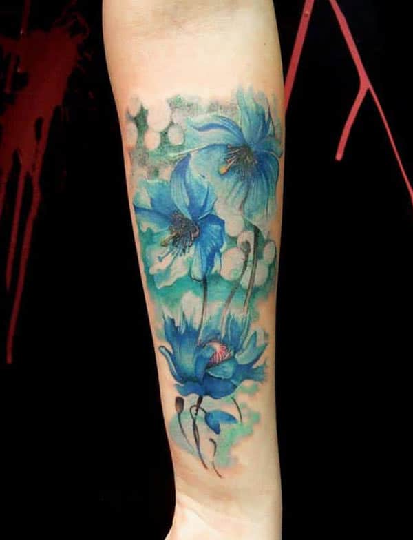 Enchanting blue water lilies tattoo designs on hand for Anthophile women