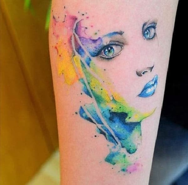 Spellbind eye-catchy woman’s face watercolor tattoo designs on hand for Chic style Ladies