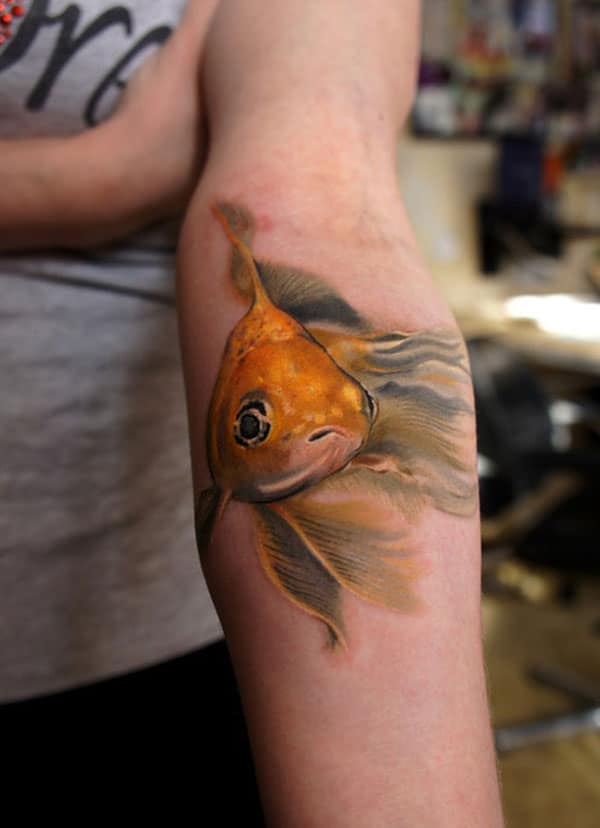Stunning realistic Golden fish watercolor tattoo designs for Girls on hand