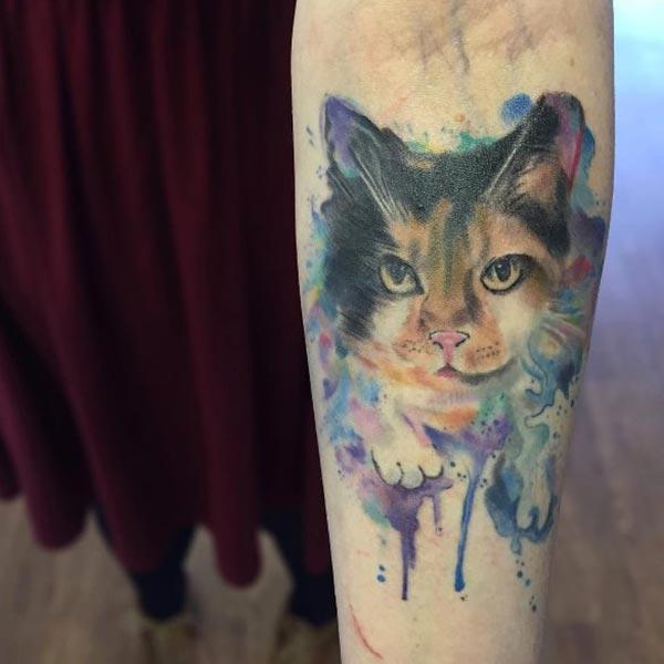 Ink splashed charming cat face watercolor tattoo on hand for Girls