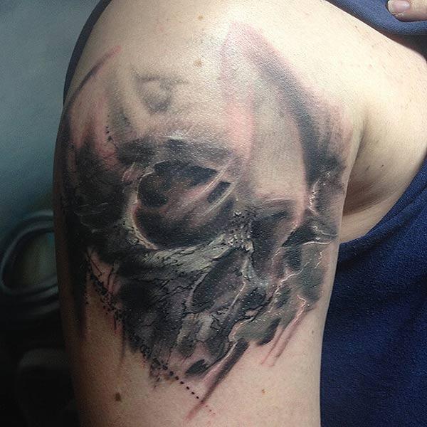 Surreal skull trash polka watercolor shoulder tattoo ink ideas for men