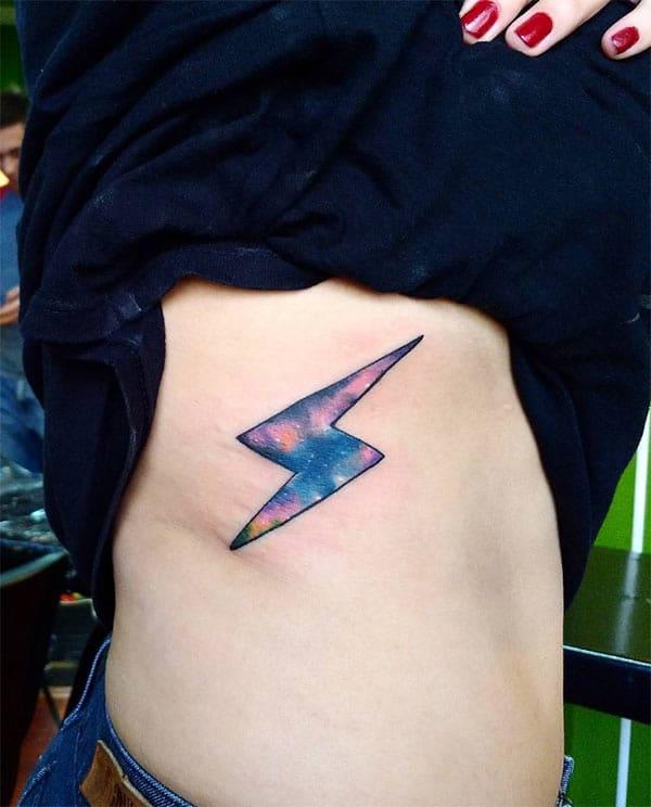 Girl’s Deep colored lightning bolt watercolor side tattoo