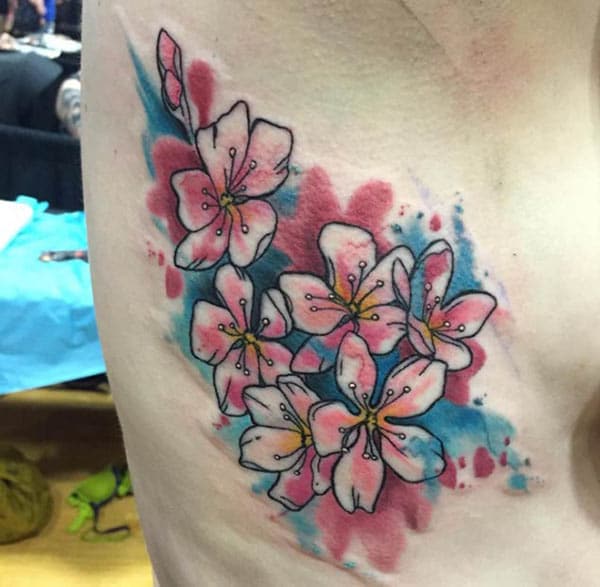 Alluring pink blue orchids watercolor side tattoo ideas for trendy girls
