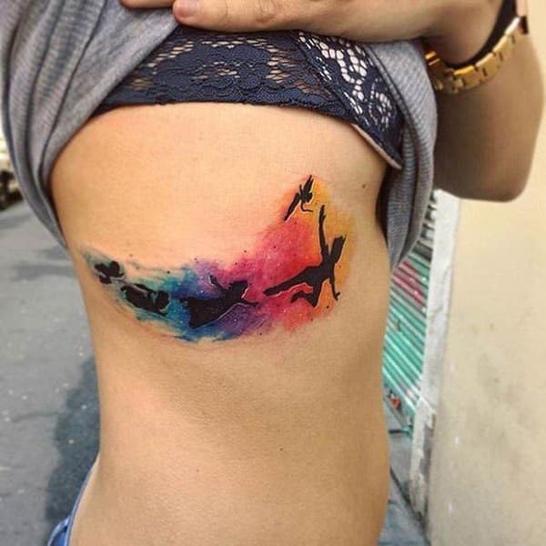 Rainbow colored life transformations tattoo ideas on side for Adventurous Women