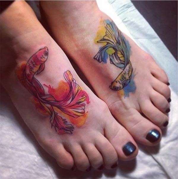 Enchanting Vibrant koi fishes on either leg watercolor tattoo designs for Girls