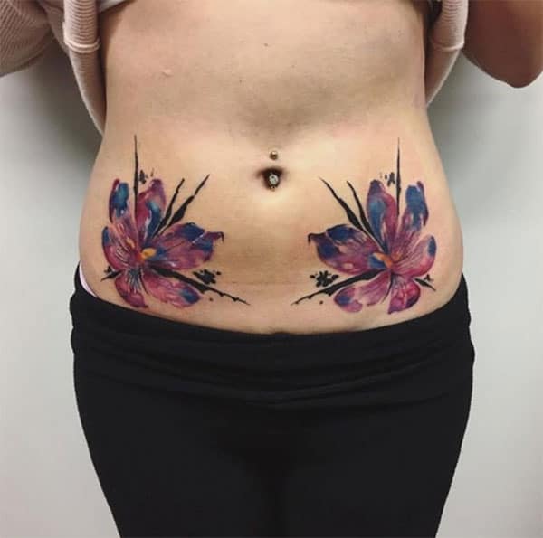 Attractive huge flowers on both sides of belly tattoo designs for Girls