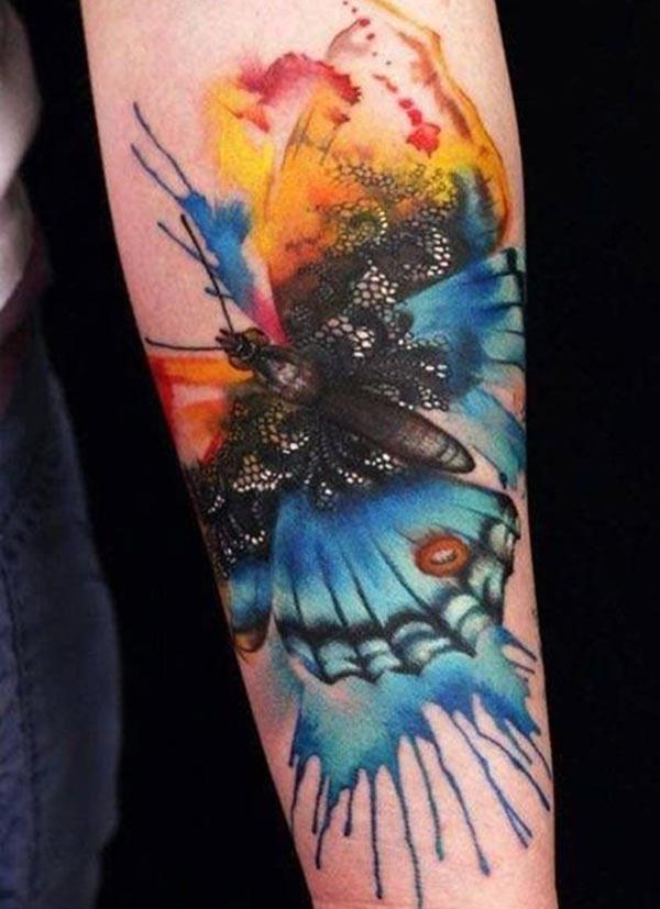 Butterfly water color ink forearm tattoo ideas for men who love transformation