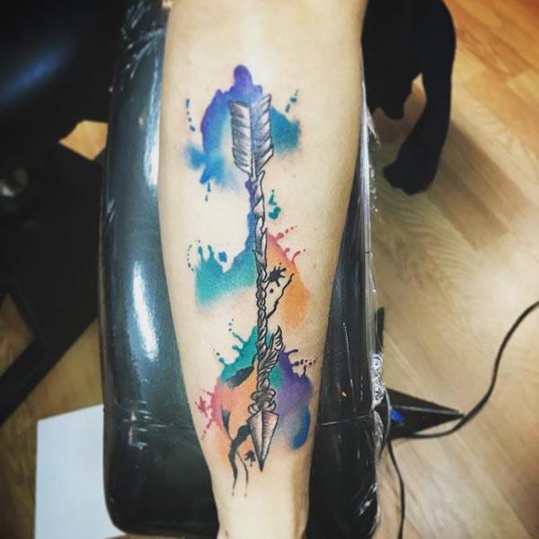 Brilliant and Conspicuous Arrow Water color Ink Forearm tattoo ideas for adventurous men 