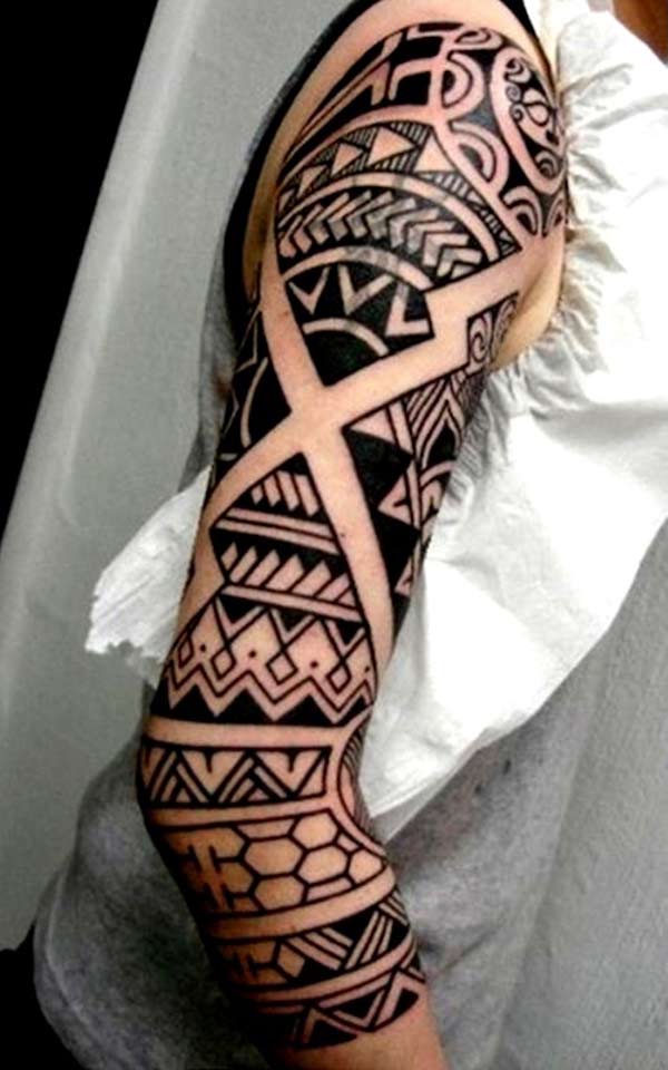Visually stunning bold geometric tribal tattoo on arm for guys
