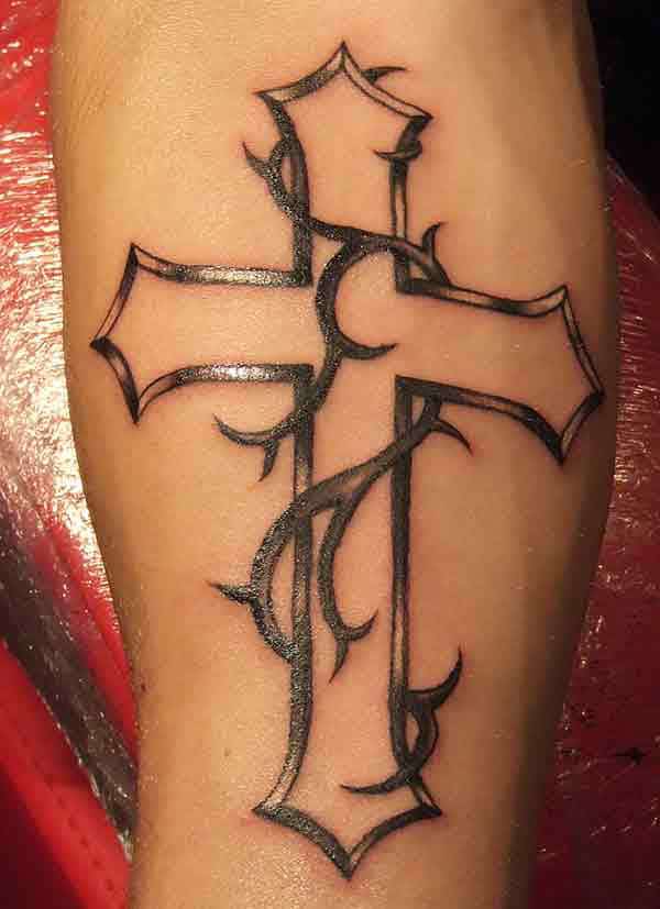Beautiful vine covered tribal cross tattoo ideas on forearm for Men