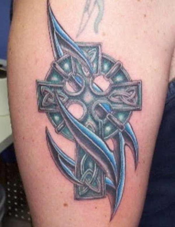 Catchy greenish black tribal cross tattoo ideas on arm for Guys