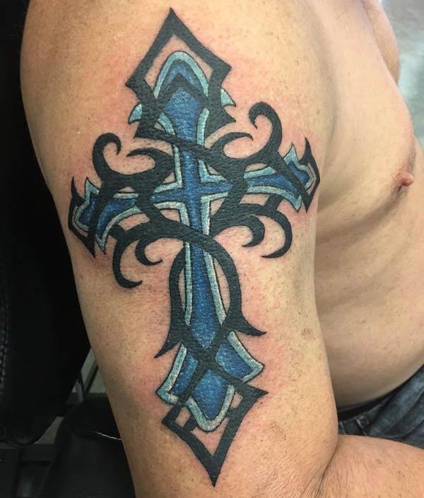 Attractive blue black tribal cross tattoo design on shoulder for Men