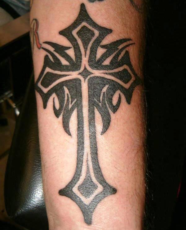Guy’s Broad black lined tribal cross tattoo ideas on shoulder 