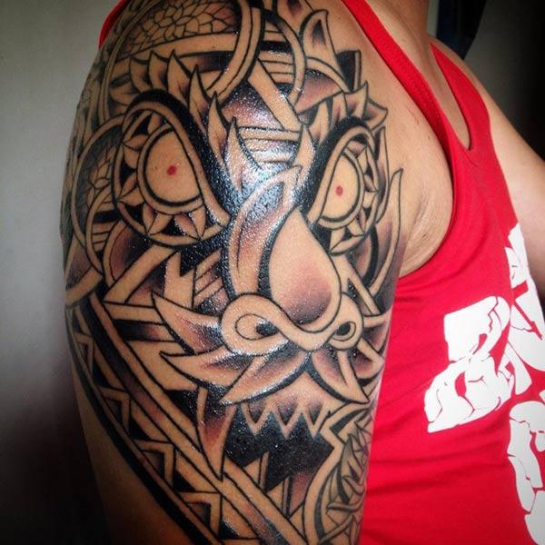 Fierce looking tribal dragon tattoo designs on shoulder for boys