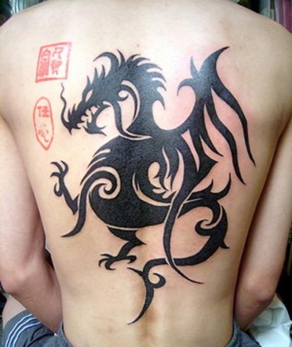 Eye catchy black Celtic dragon tattoo ideas on back for Men