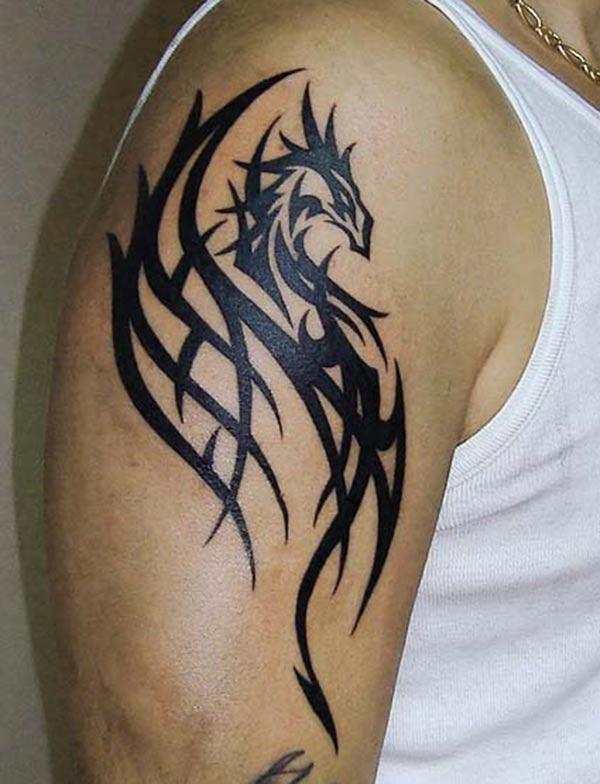 Stunning solid black tribal dragon tattoo ideas on Shoulder for Guys
