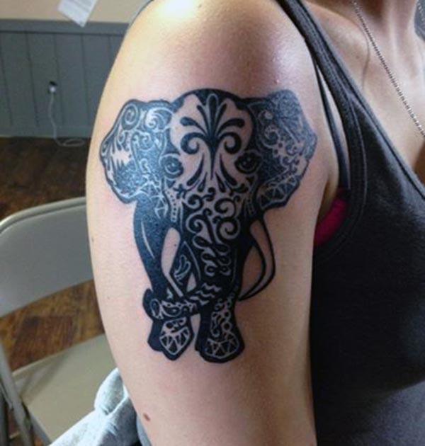 Attractive black colored tribal elephant tribal tattoo ideas on shoulder for Women