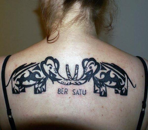 Intense black lines tribal elephant tattoo design on back for Girls