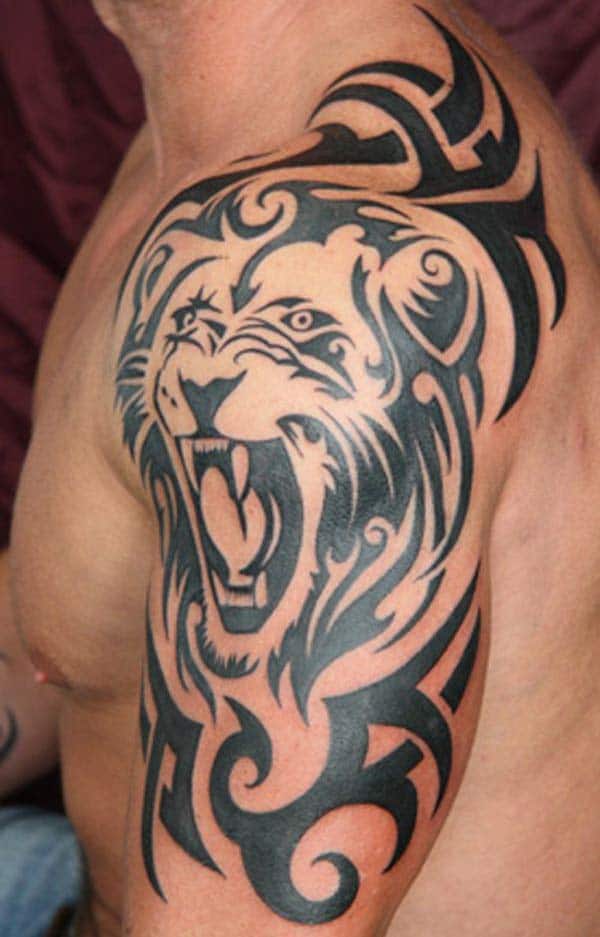 Jaw-dropping snarling Tribal lion head tattoo designs on arm for Men