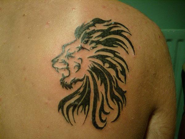 Aggressive bold line tribal lion head tattoo on back shoulder for Strong Men