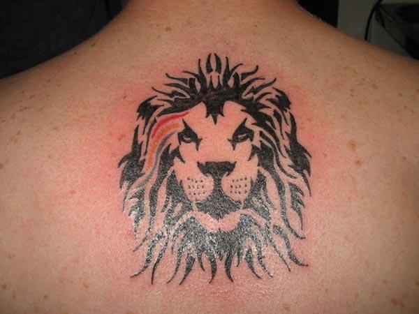 Men’s Captivating scowl faced lion tribal tattoo ideas on back 