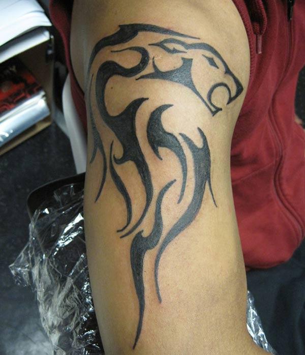 Cool Celtic lion head tribal tattoo designs on arm for Masculine Guys