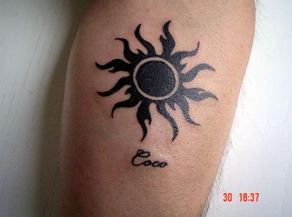 Eclipsed flaming sun tribal tattoo ideas on arm for Guys