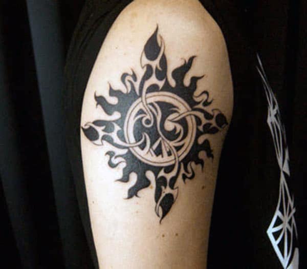 Engrossing tribal sun tattoo ideas on arm for Men