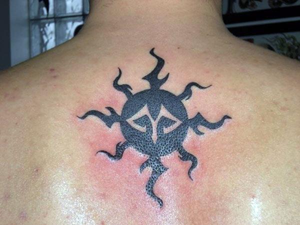 Compelling complete black sun tribal tattoo ideas on back for Guys