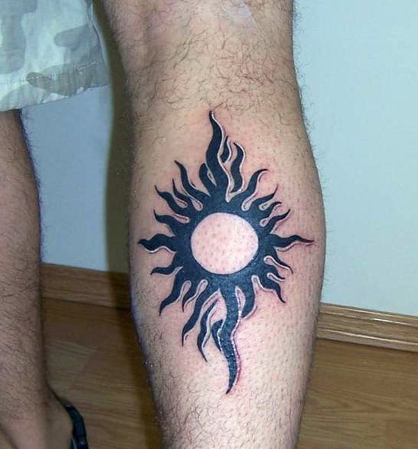 Amazing flaming sun tribal tattoo designs on calf for Men