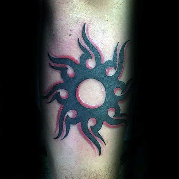 Stunning intense black red tribal sun tattoo design on arm for Guys