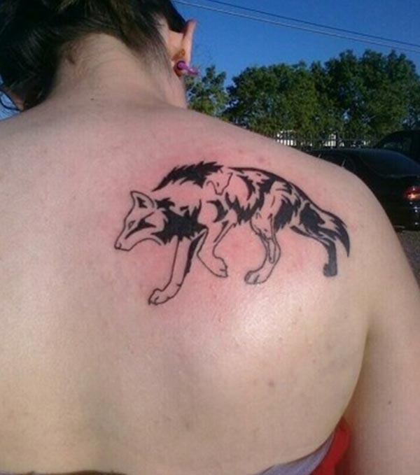 Attractive tribal wolf back shoulder tattoo designs for Ladies