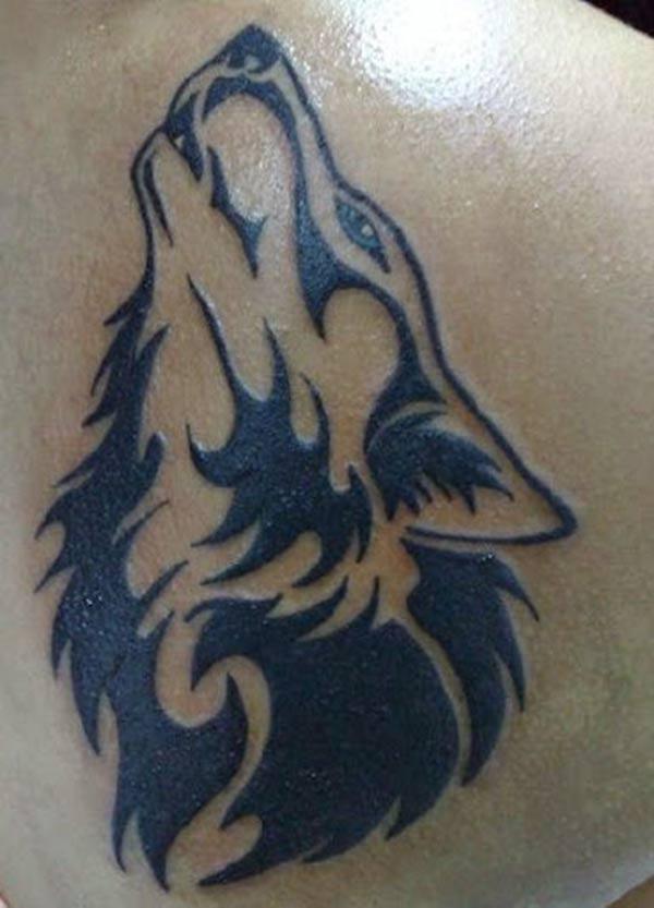 Appealing howling wolf head tribal tattoo designs on back shoulder for Ladies