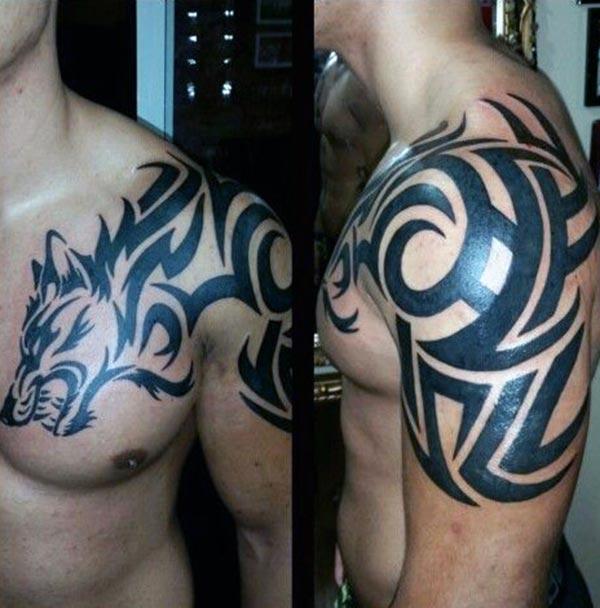 Captivating bold snarling wolf head tribal tattoo ideas on front shoulder for guys
