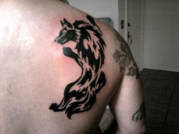 Stunning Ferocious wolf tribal tattoo ideas on back shoulder for Guys