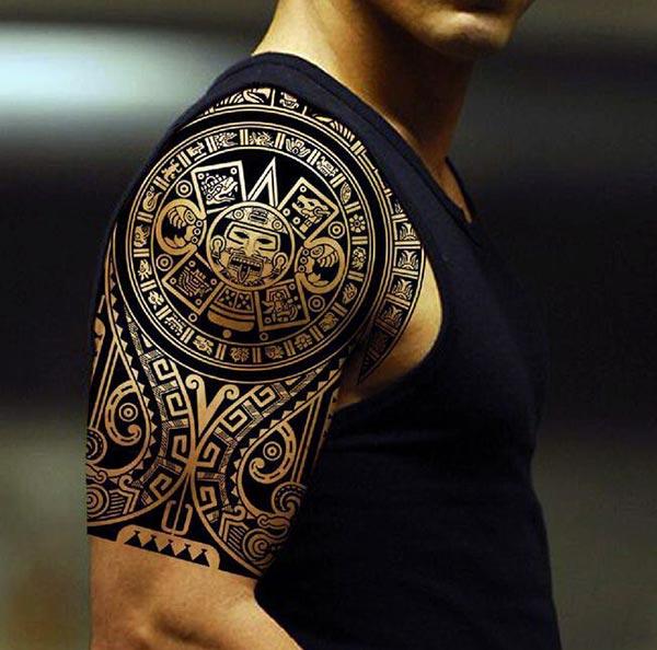 Beautiful intricately carved Aztec tribal shoulder tattoo ideas for Men