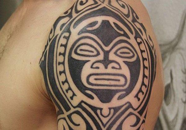 Appealing broad black lined Aztec tribal tattoo ideas for Guys