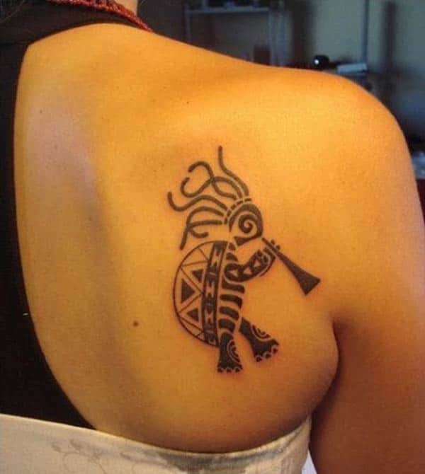 Eye catchy cute tribal kokopelli turtle playing flute tattoo designs on back shoulder for Women
