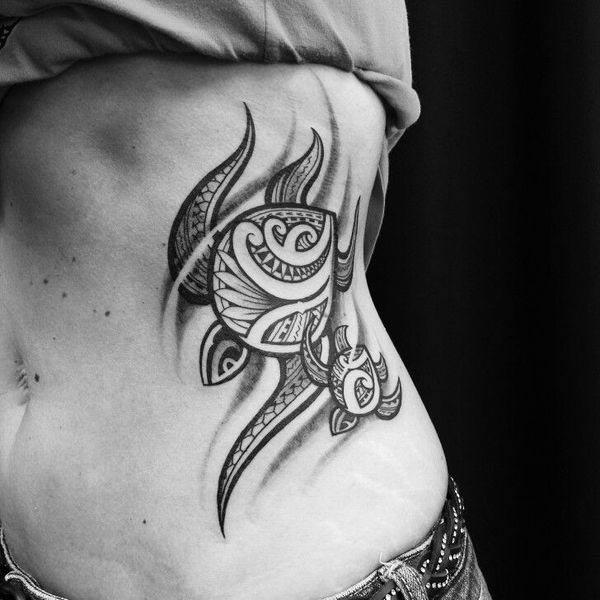 Jaw dropping Polynesian tribal turtle tattoo ideas on side for Women