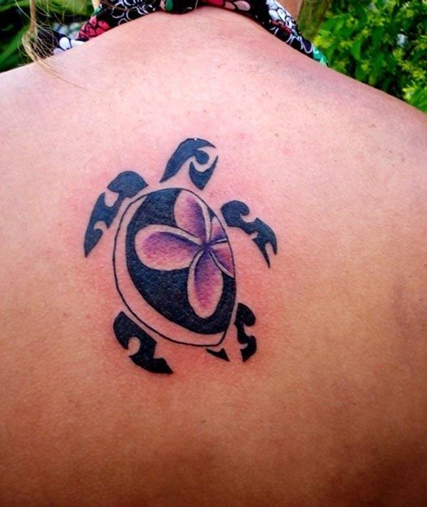 Enchanting Hawaiian tribal tattoo of turtle with purple orchids on Women on back