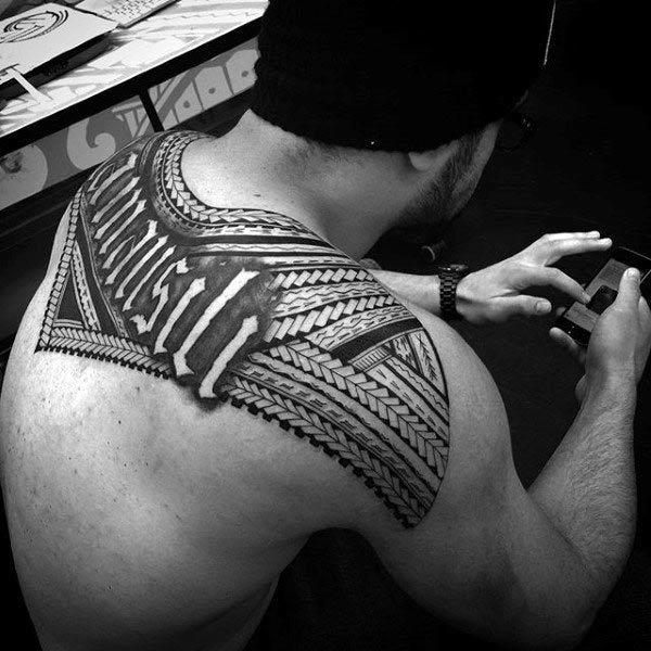 Breathtakingly intricate Hawaiian tribal tattoo ideas for Guys on upper back