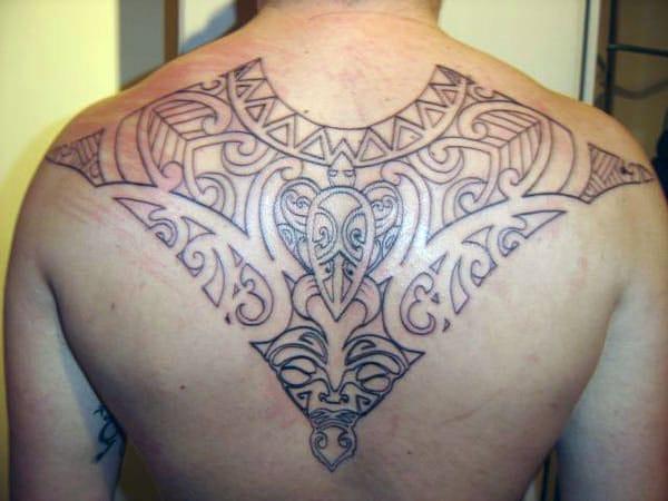 Awe-inspiring Hawaiian tribal tattoo on back for Boys